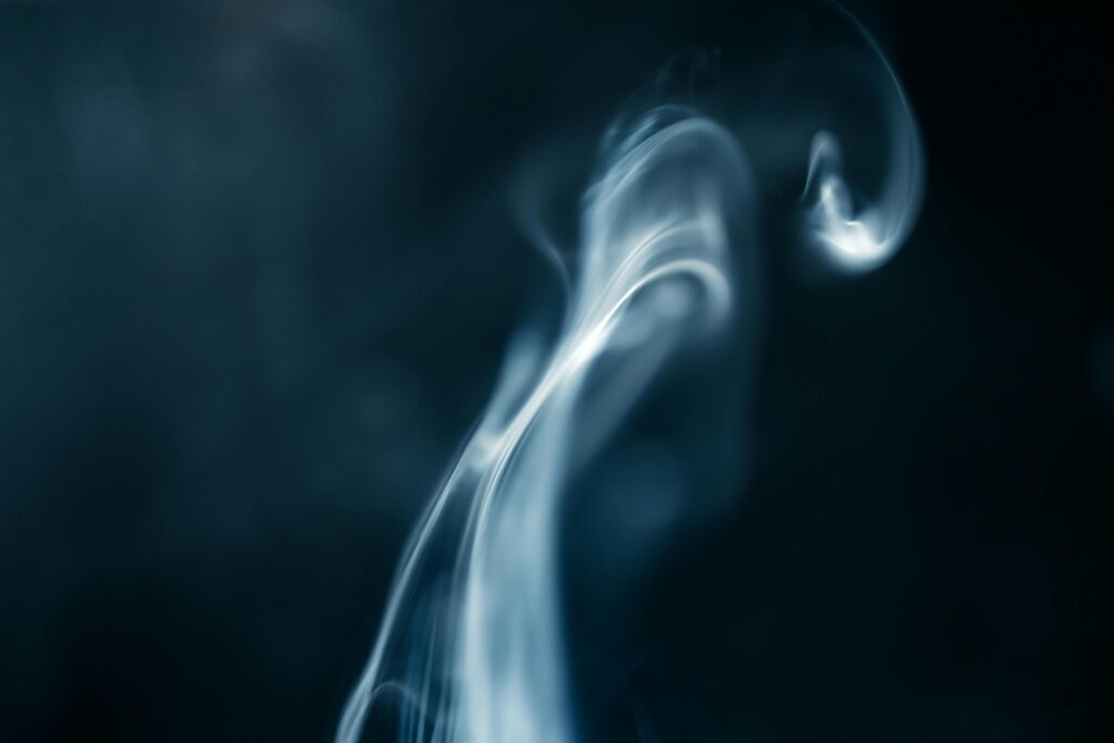 A captivating abstract image of swirling smoke against a dark background.