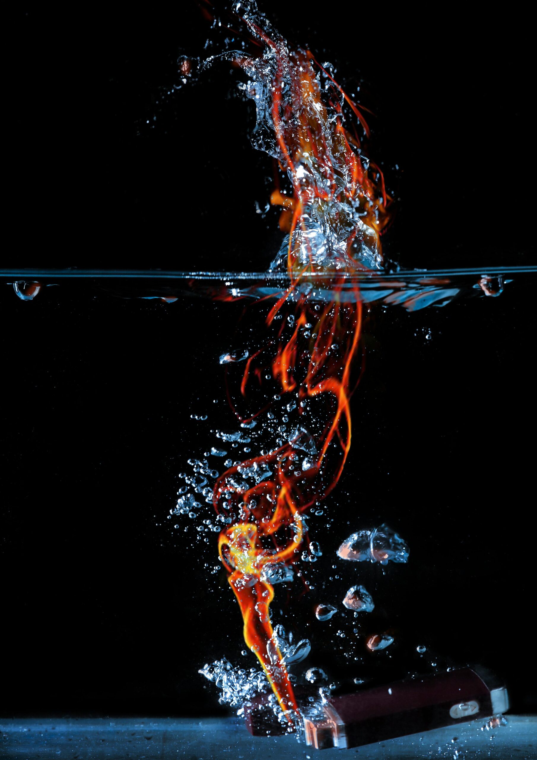 Vibrant fire and water dynamics captured in an underwater scene.